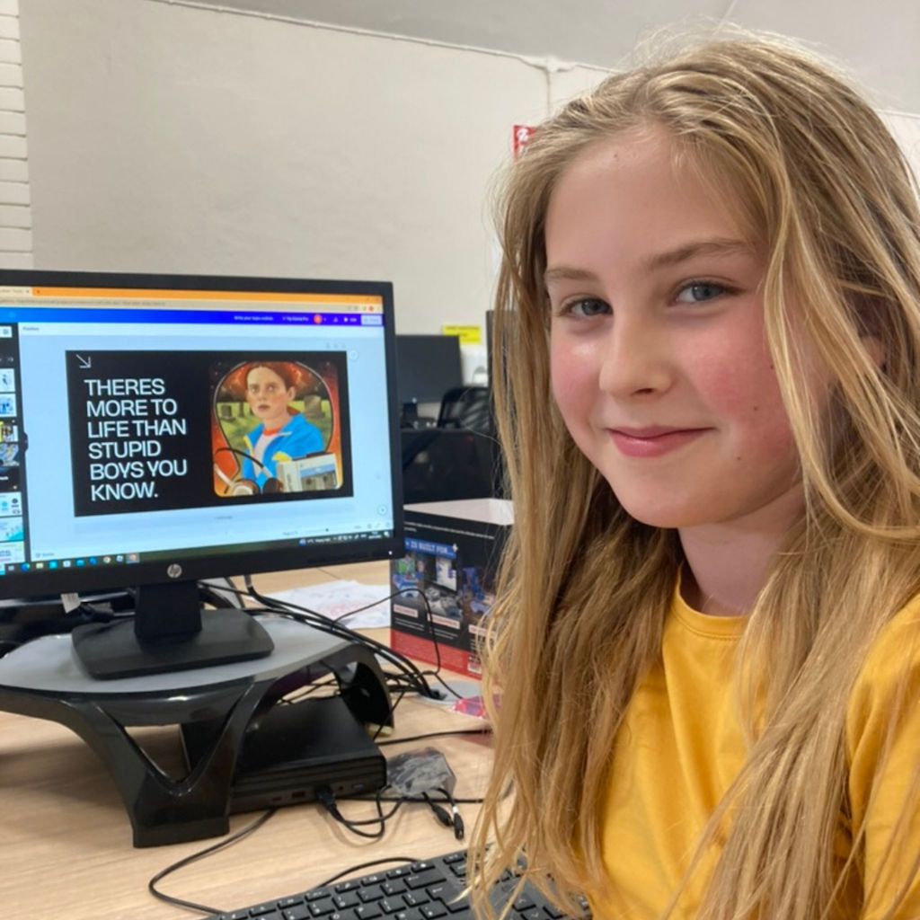 girl age 11 presents the digital poster she made on Canva at digikids Dden summer camp 