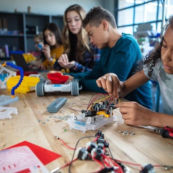 teenagers design and build sphero rvr a programable robot
